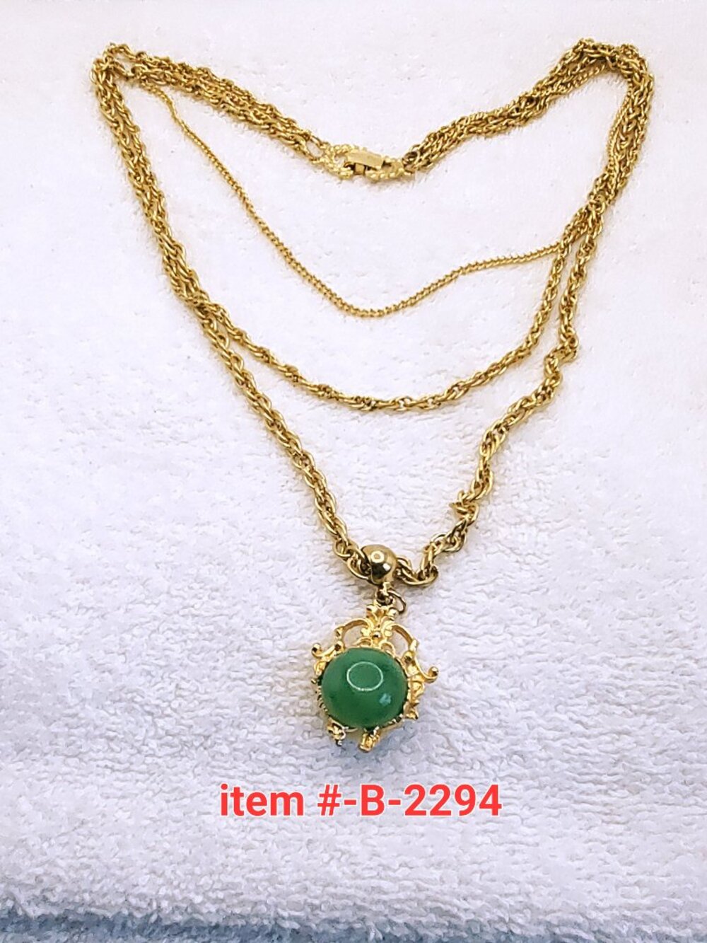 1 Gold 3 chain necklace w/green/white stone pendant , item # B2294, wt.69 grams.
